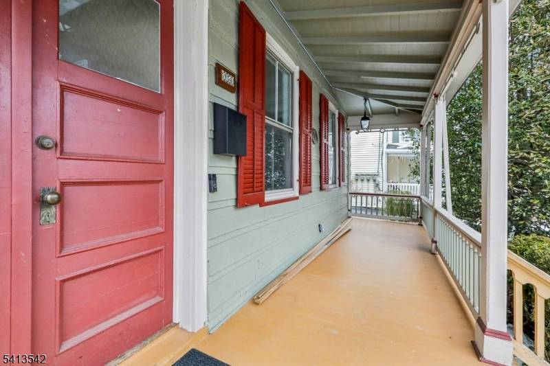 This stately five bedroom Colonial stands as a monument to traditional symmetry and enduring craftsmanship, greeting guests with an inviting entry foyer and windows that define its historic facade.