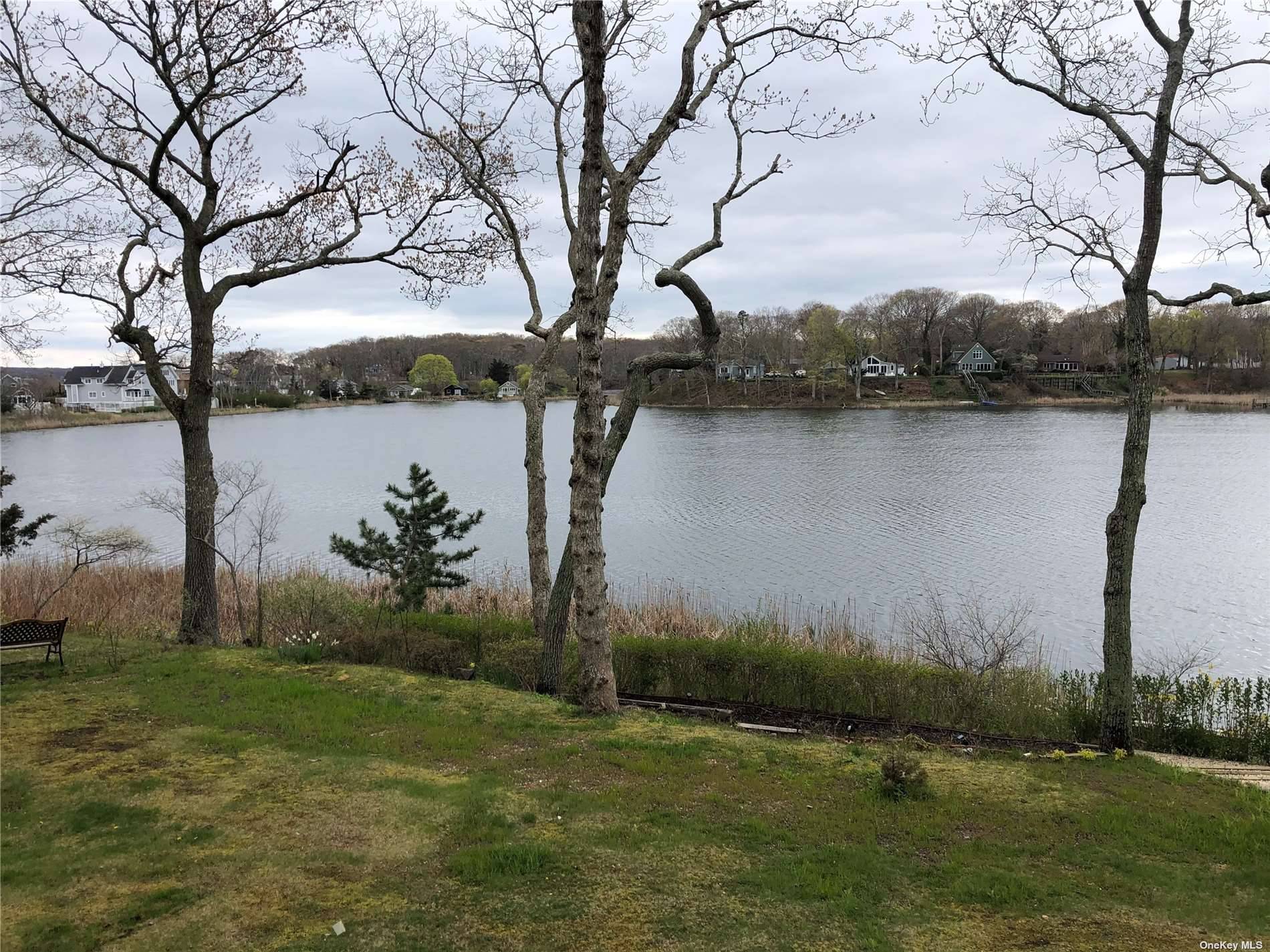 East Marion, North Fork Lakefront living with incredible sunsets and private ass'n bay beach.