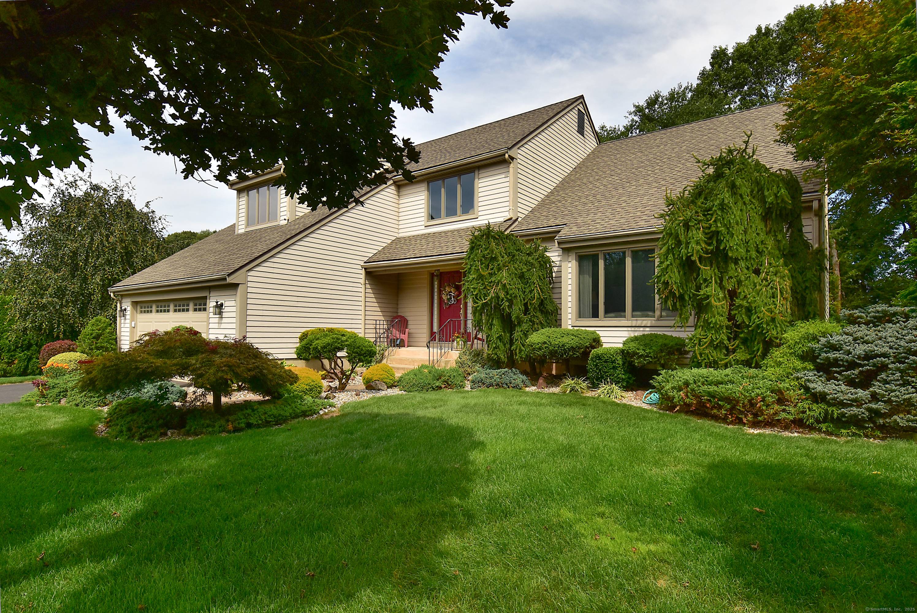 This exceptional home has been renovated from top to bottom with custom trim work, built ins, a designer kitchen, home office, and extraordinary exterior details.