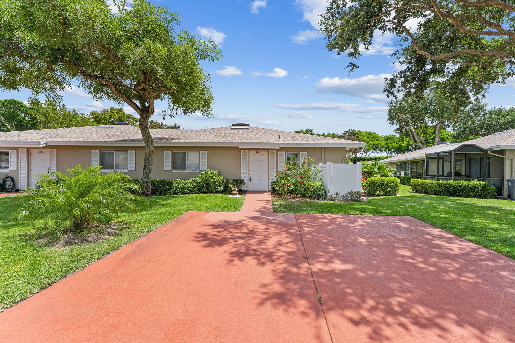 Discover your own personal paradise in this charming single story corner villa, nestled within a gated community and surrounded by lush greenery.