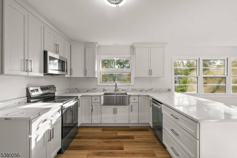 Welcome to this beautifully renovated 4 bedroom, 3 bathroom custom home in the heart of Montville.