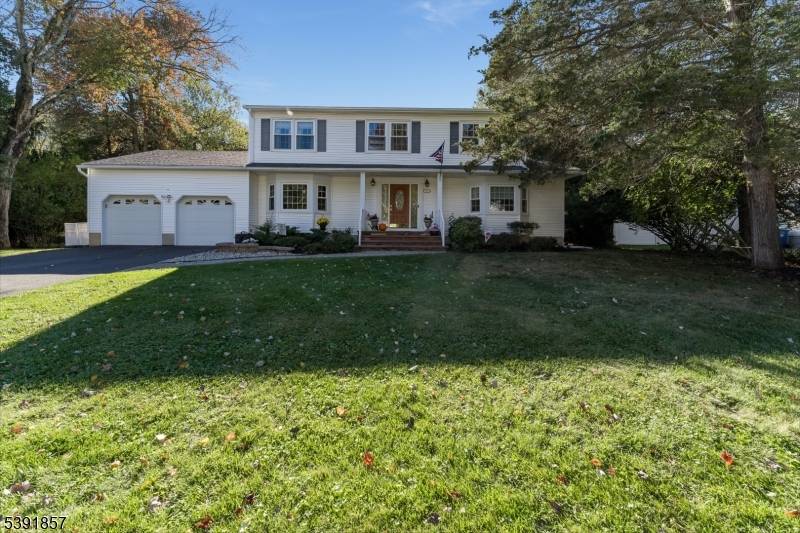 Beautiful Colonial Home is Bright, Sunny, Cozy and BACKS TO PARK LAND.