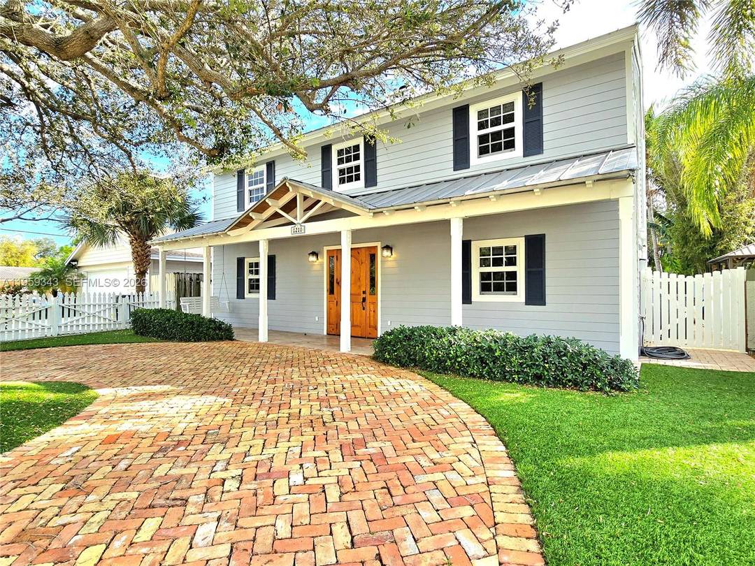 Located in the sought after Palm Beach Farms East Boca neighborhood, this 4 bedroom loft, 2.