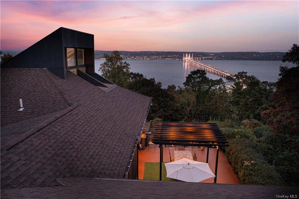BIRD'S EYE VIEW In a world filled with extraordinary homes, 3 North Tweed Boulevard stands apart as a true masterpiece where the Hollywood Hills on the Hudson River meet the ...