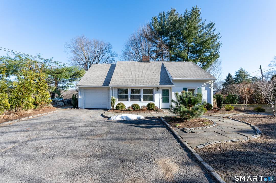 Adorable three bedroom, two full bath ranch style home with walk up attic for unlimited storage on a beautifully landscaped corner property in a convenient location minutes to everything.