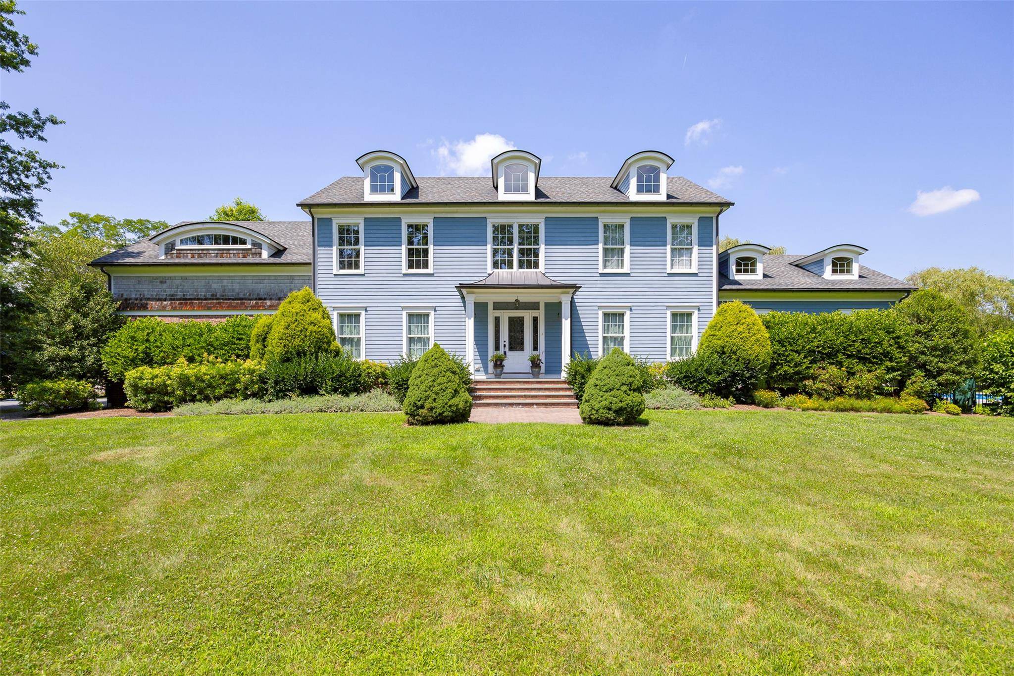 Welcome to this stunning colonial style residence, beautifully situated on 6.