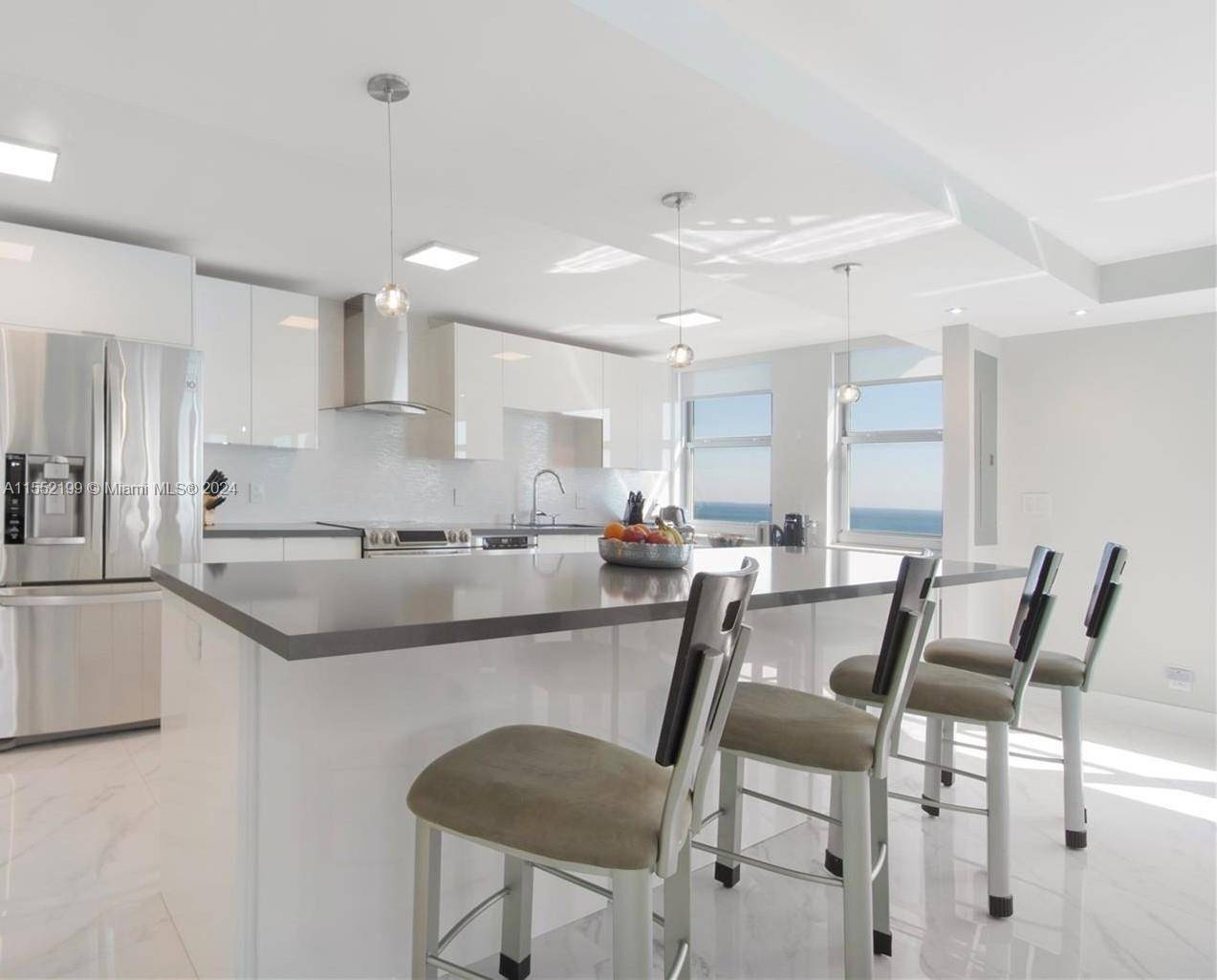 Indulge in spectacular direct oceanfront views from every window of this completely remodeled, corner residence with high end upgrades.