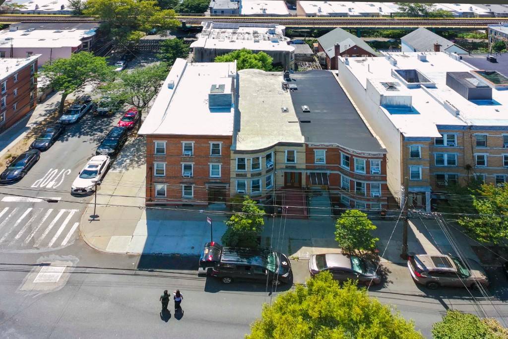 Exceptional opportunity to own a well maintained brick corner building located in the heart of Ridgewoods Historic District, just off Fresh Pond Road.