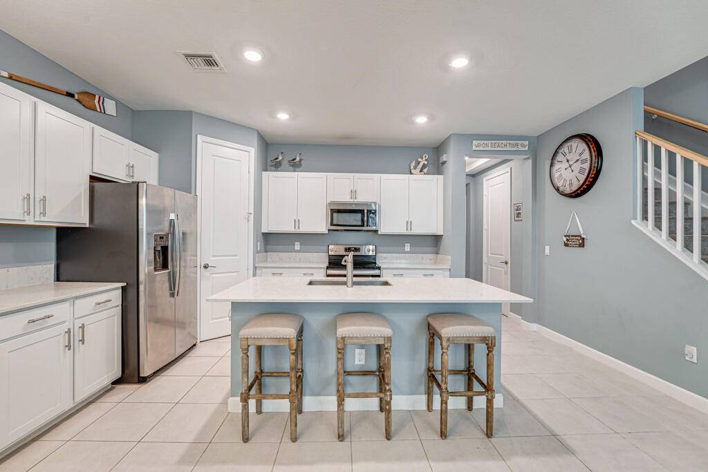 Discover modern comfort in this stunning 2020 built home located in Arbor Parc, a centrally situated gated community in Riviera Beach.