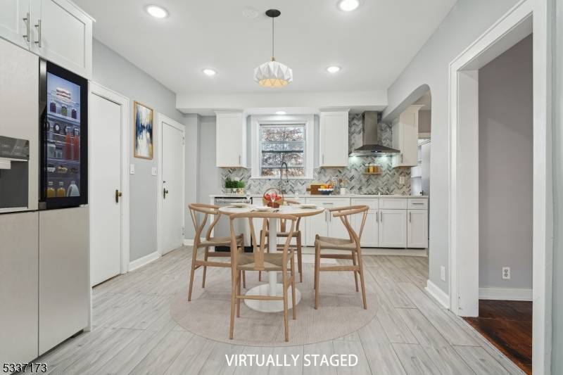 This impeccable 4 6bedroom, 2 bath Colonial home, nestled on a tranquil street, boasts over 3, 200 sq.