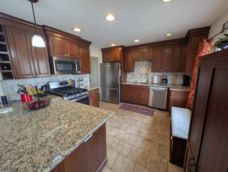 Set in the Prestigious Victoria Drive neighborhood of Clark, you'll find this Classic Bi Level Home located on an Extra Large 131x150 corner lot !