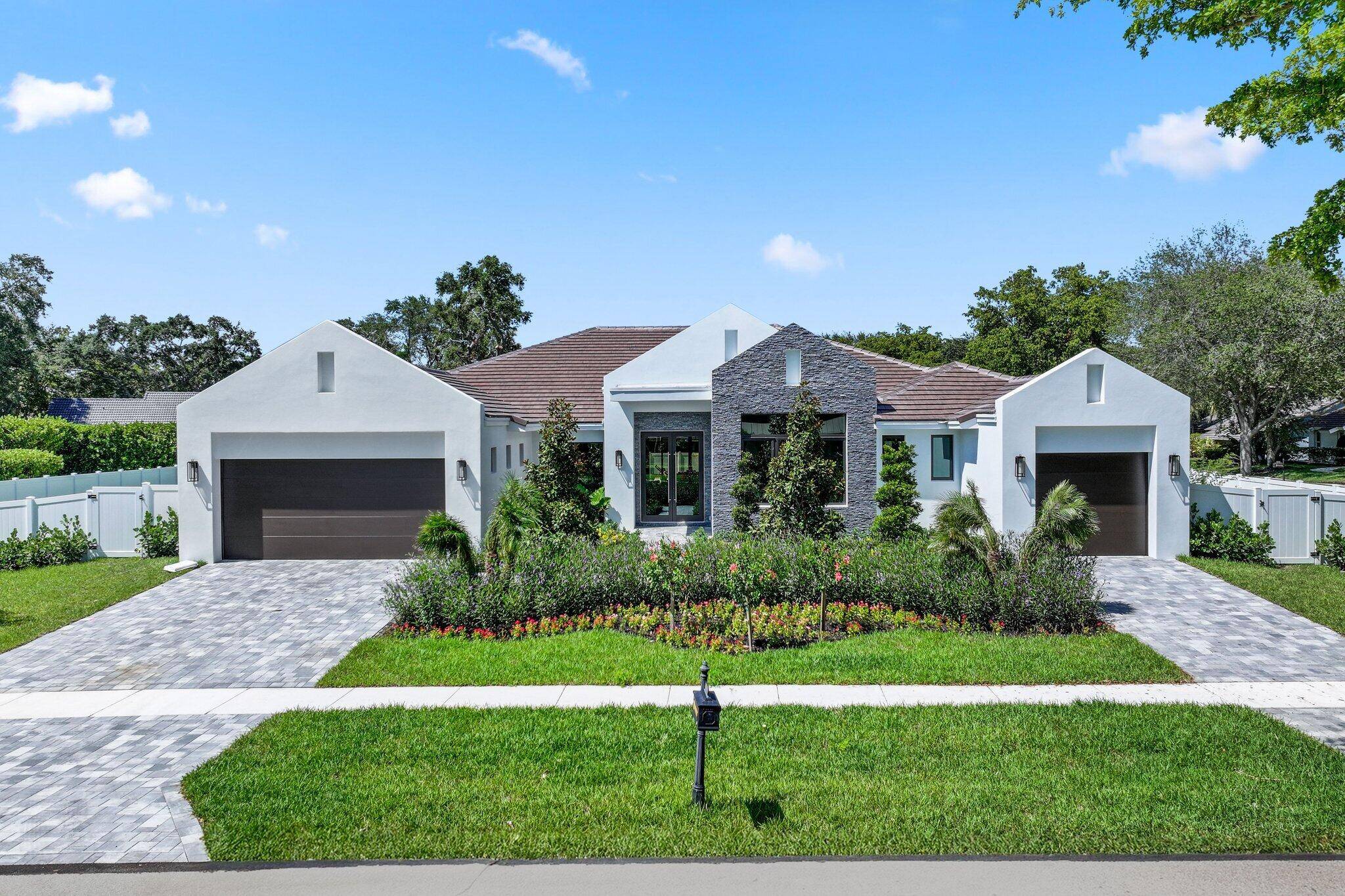 Gorgeous one story contemporary 5 BR Media Room and Study and Playroom 5 BA 1HB new construction home in the Woodfield Hunt Club.