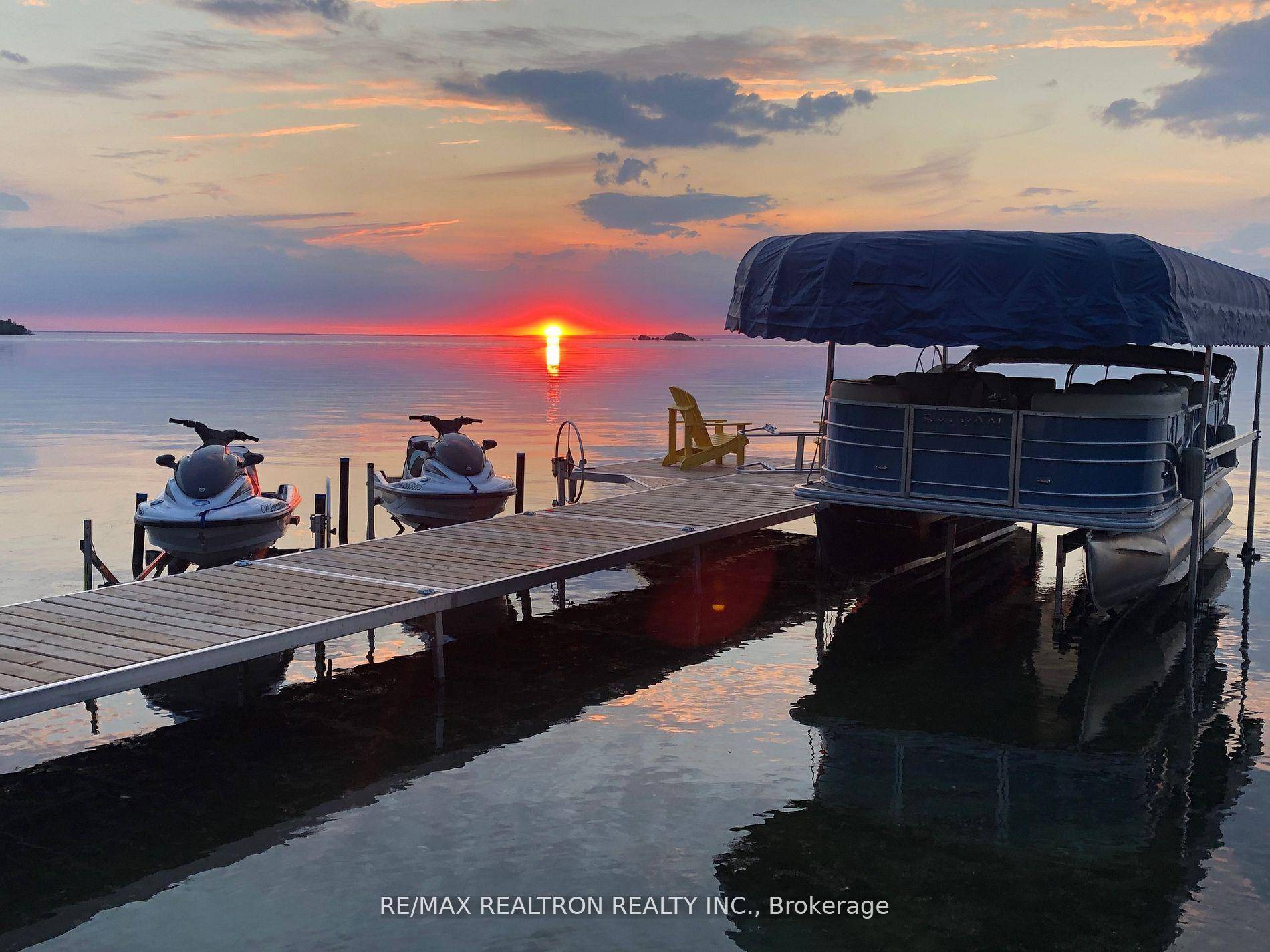 This gorgeous lakeside home provides panoramic views of Lake Simcoe from the custom kitchen amp ; living room.