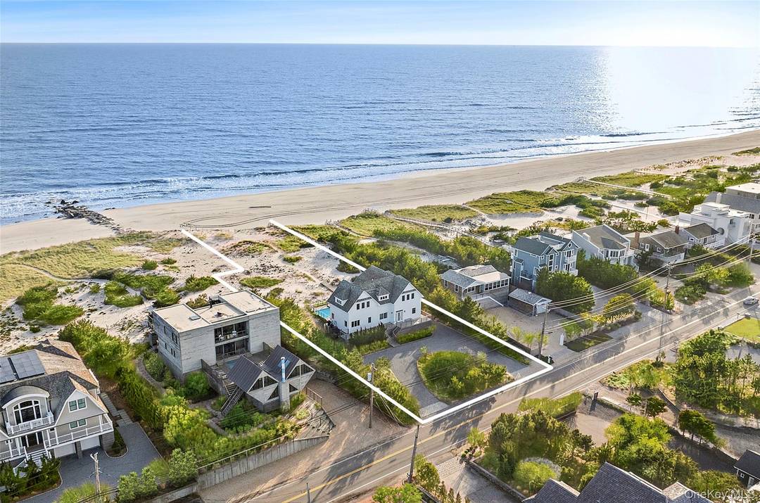 Set along coveted Dune Road, this jetty protected oceanfront property spans approx.