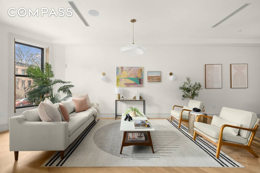 Welcome to 485 Halsey Street, a meticulously renovated 1899 townhouse that seamlessly blends timeless architectural character with refined modern living.