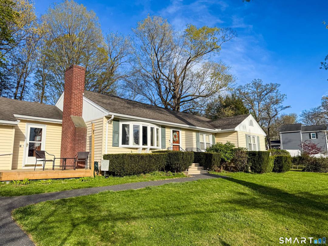 Enjoy the best of Candlewood Lake living in this custom built ranch, beautifully set on a professionally landscaped lot.