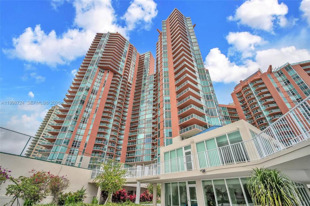 Exquisite, renovated residence in the heart of Aventura offering refined luxury and sweeping water views.