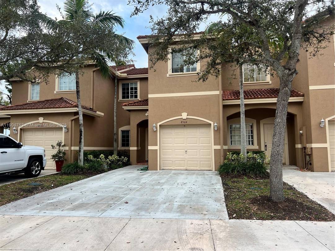 Charming two story townhome featuring a one car garage and a private, fenced in backyard.