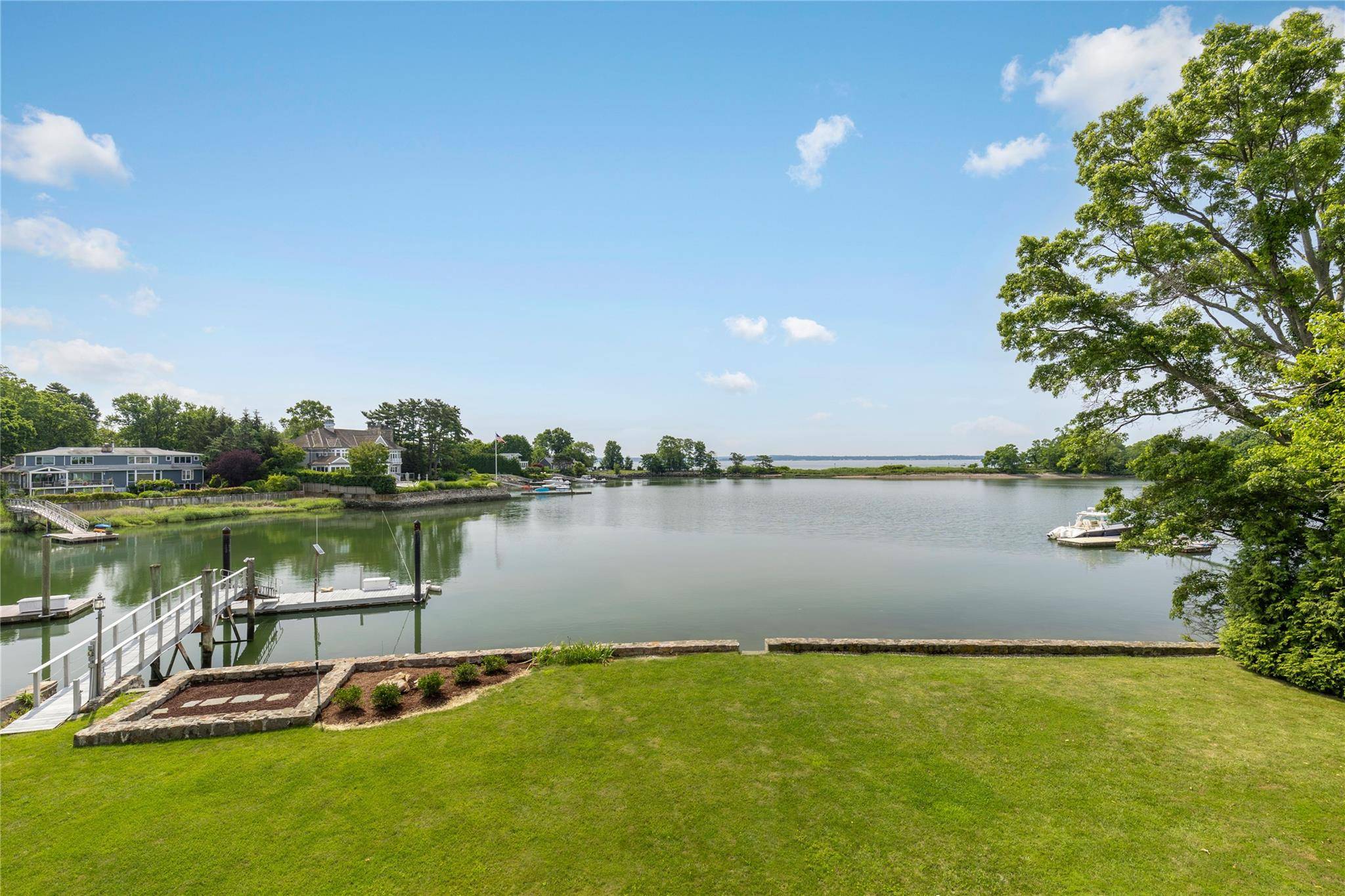 Experience iconic waterfront living in this spectacular midcentury modern masterpiece on coveted Greacen Point in Mamaroneck.