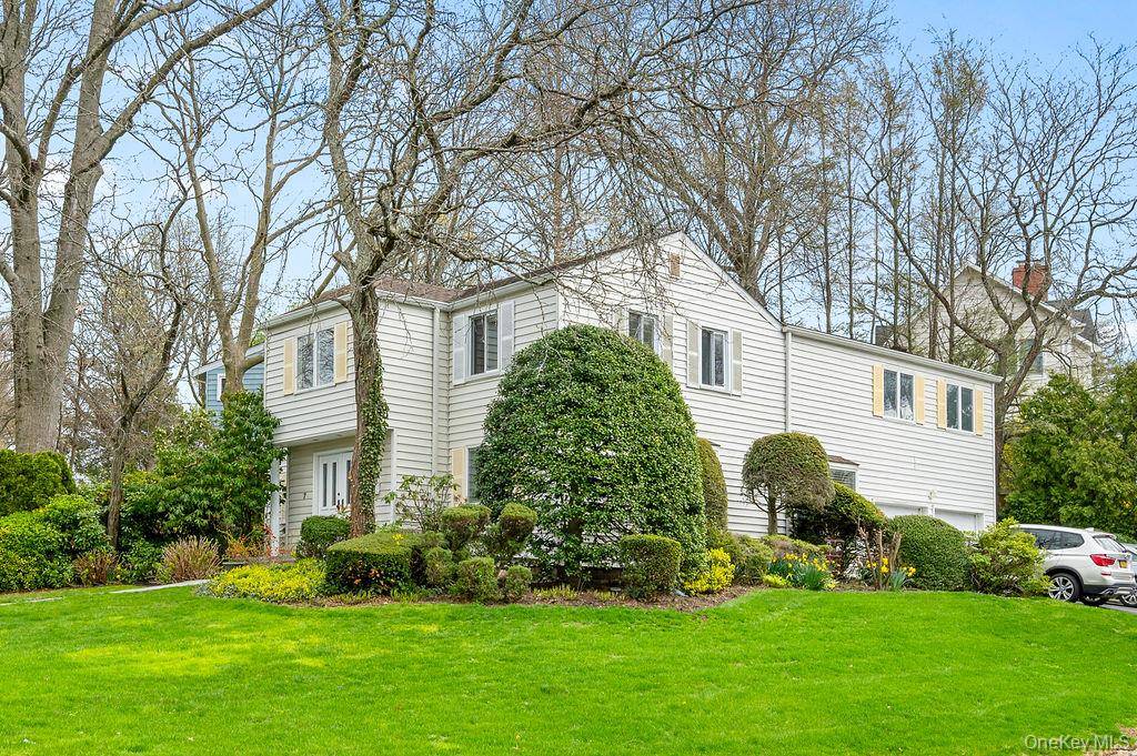 This Sunny Central Hall Colonial Home is Located in Lake Success and features 4 Bedrooms Plus a Bonus Room and 3 1 2 Baths.