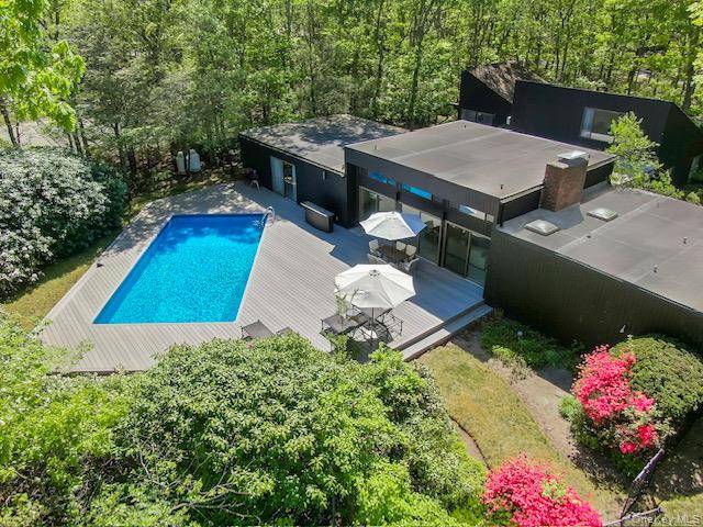 Secluded Westhampton Oasis with Pool, Tennis, and Open Concept Living Tucked away on a private 1.