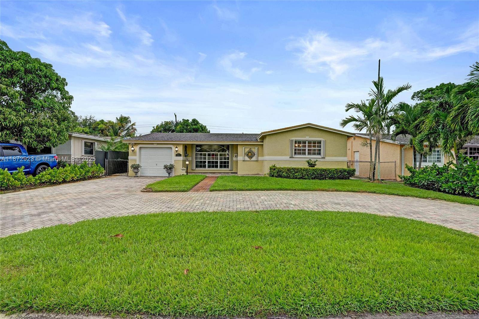 Charming, upgraded 3BD 2BR home with a circular paver driveway, garage, den amp ; screened patio.