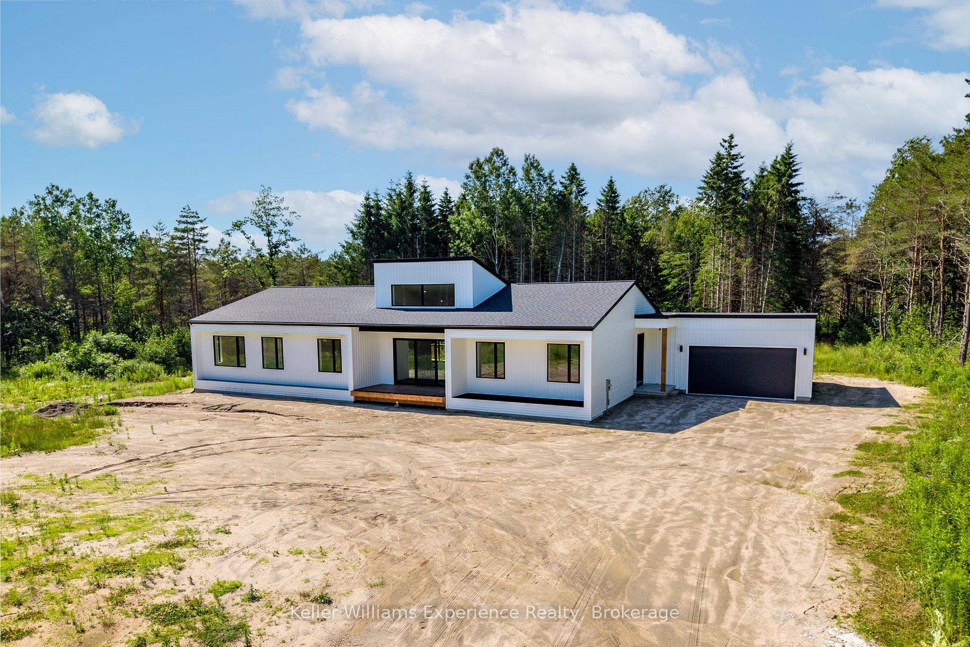 Built in 2024, this stunning modern home sits on 47 acres of natural beauty, offering the perfect blend of privacy, space, and sleek design.