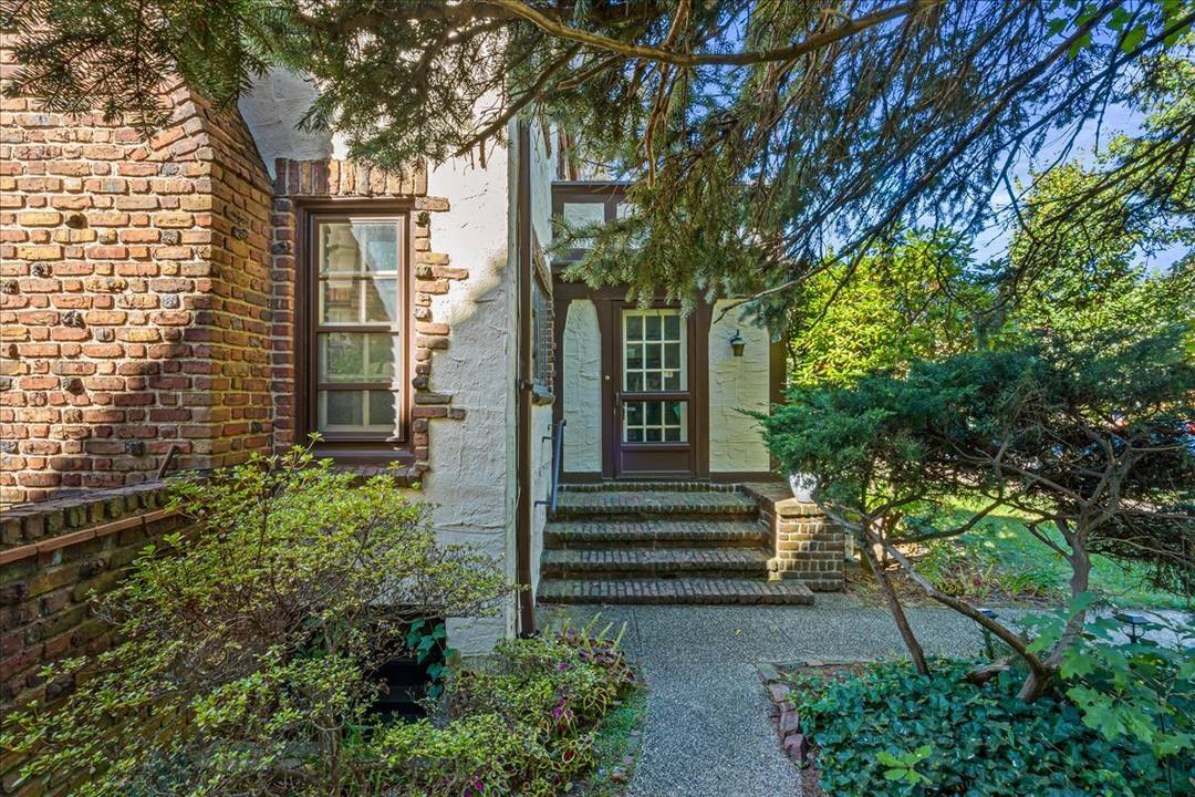 Charming semi attached home in Forest Hills Gardens featuring 4 bedrooms and 3 bathrooms, blending timeless architectural charm with modern versatility.