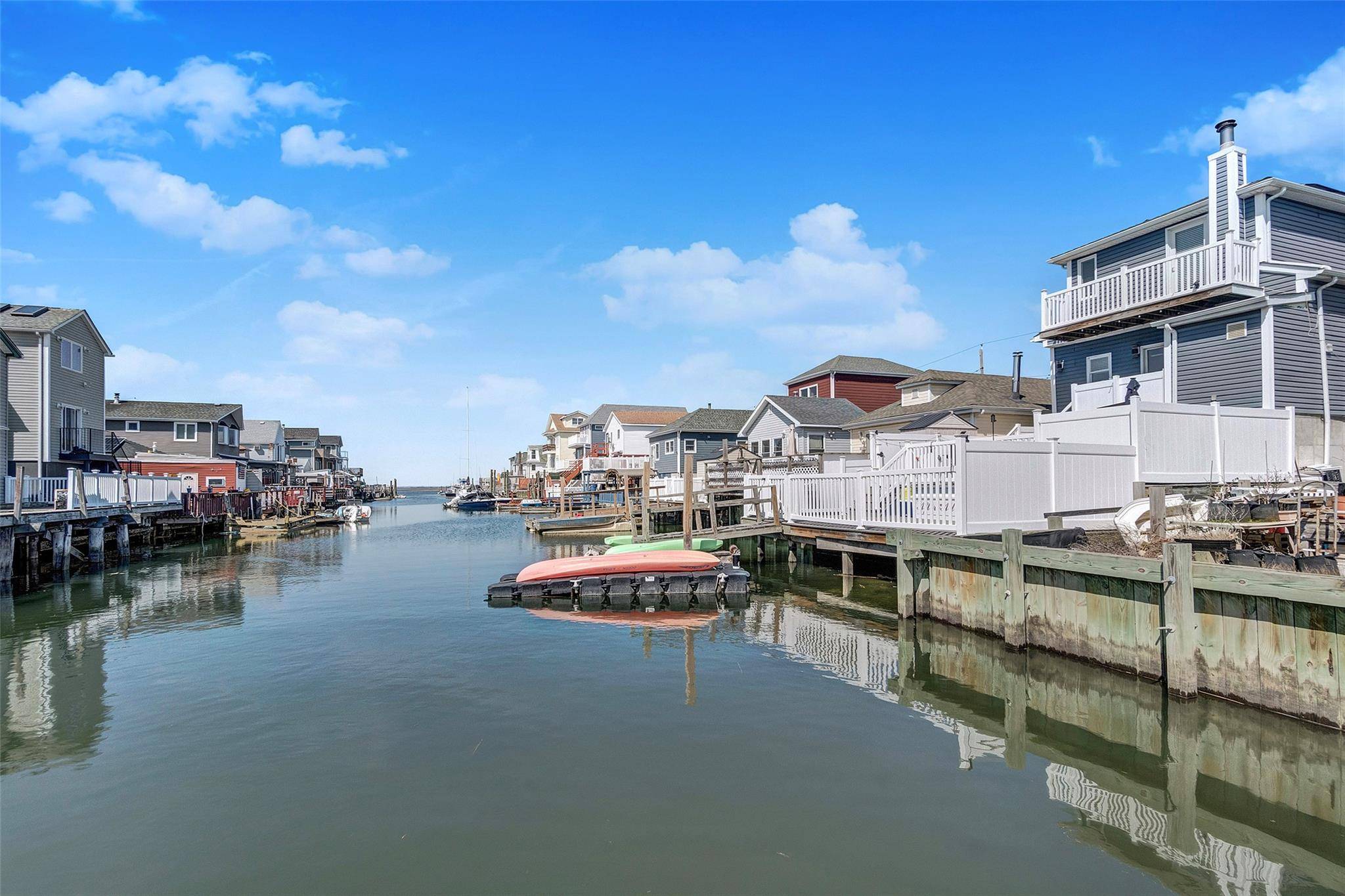Waterfront Living in Broad Channel, Queens Discover the charm and versatility of this legal two family home, currently enjoyed as a spacious one family retreat, nestled along the canals of ...