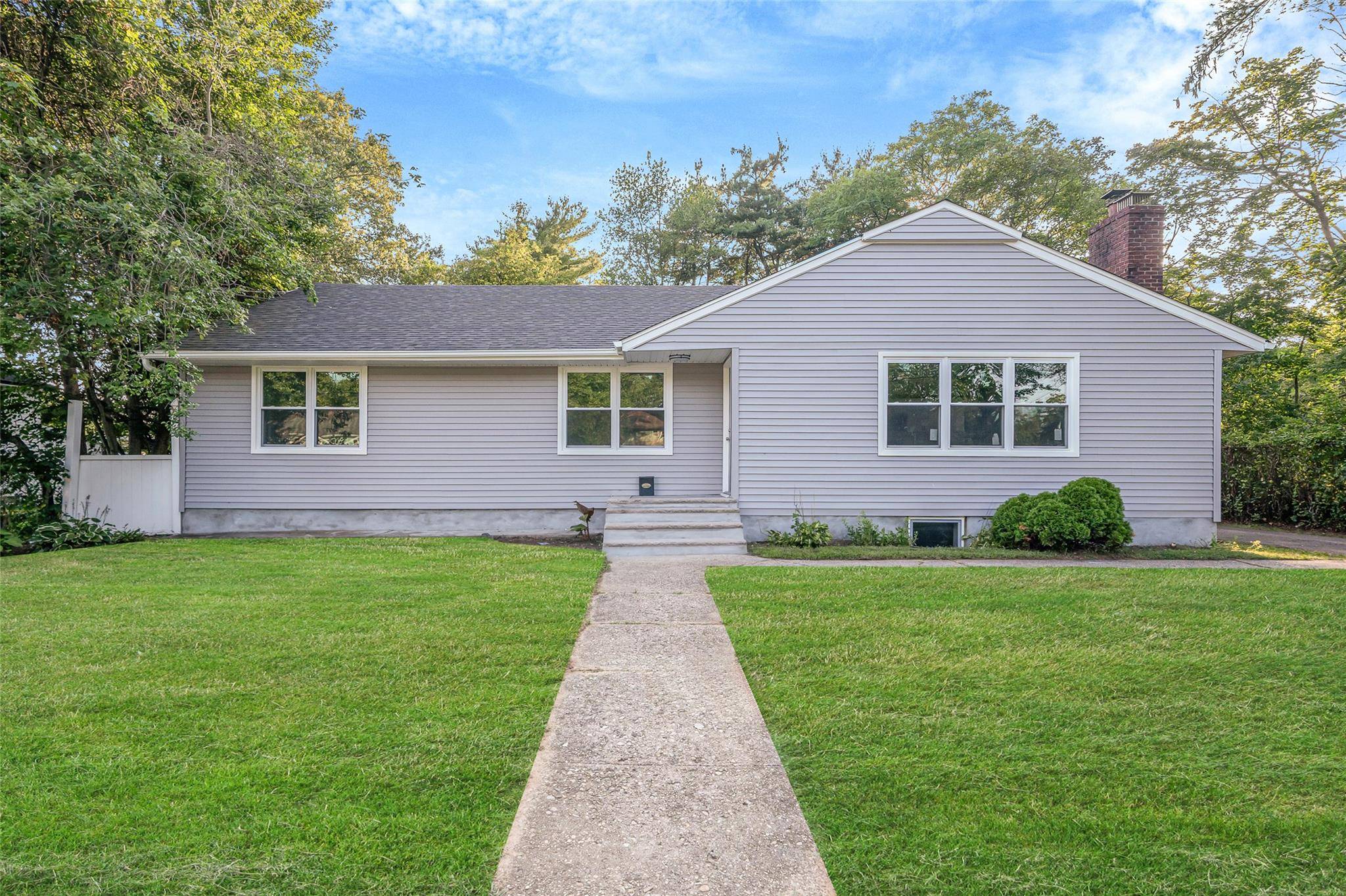Welcome to 128 N 22nd Street, Wheatley Heights, NY a fully renovated single family ranch offering four bedrooms, two bathrooms, and a newly finished basement.
