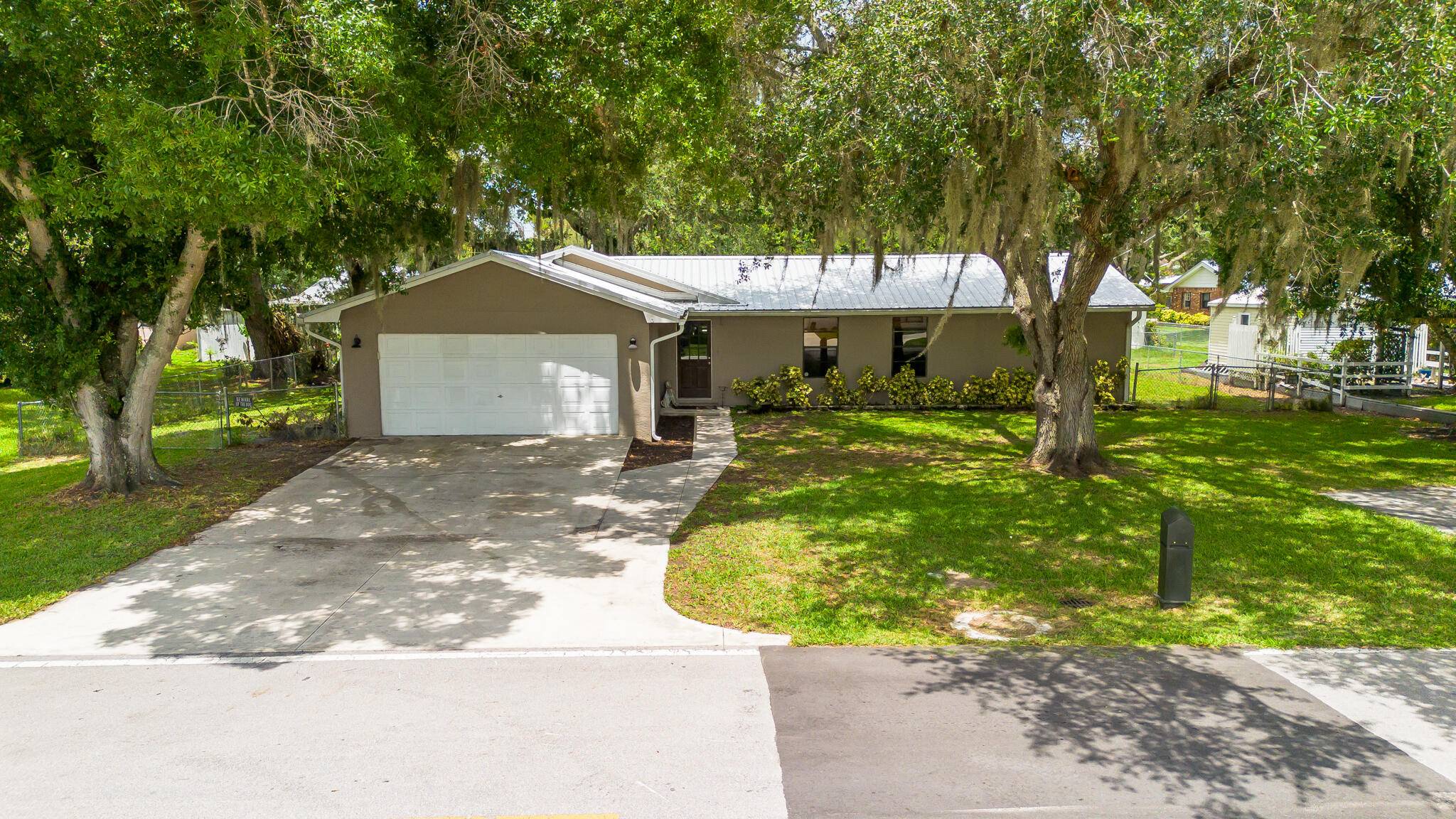 Welcome to your private retreat just outside the city limits in the peaceful neighborhood of River Lake Estates.