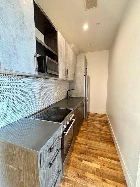 Super Sun Drenched Renovated 4 Bed 2 Bath Duplex with Condo Finishes and Private Outdoor SpaceNew Stainless Steel Kitchen with a Dishwasher, Microwave and Stone Counters2 Renovated BathroomsSpacious BedroomsPrivate DeckOn ...