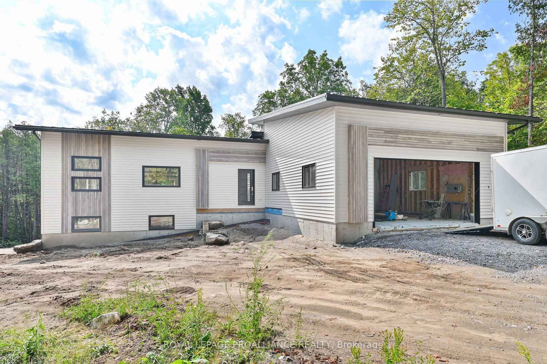Welcome to this bright and contemporary bungalow, perfectly set on a stunning wooded 1.