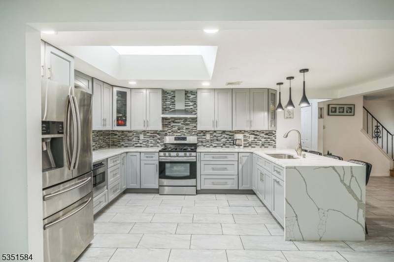 This spacious, expanded Cape Colonial is located on a quiet street.