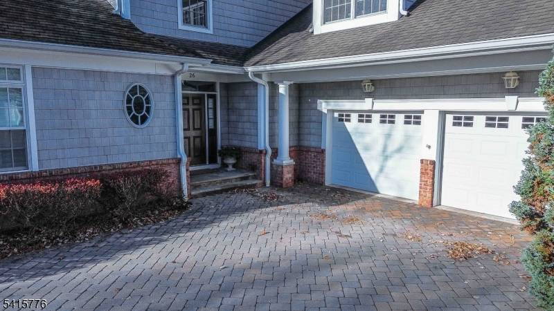 Discover exceptional privacy in this sun drenched upscale townhome located in the desirable Green Village section of Chatham Township.