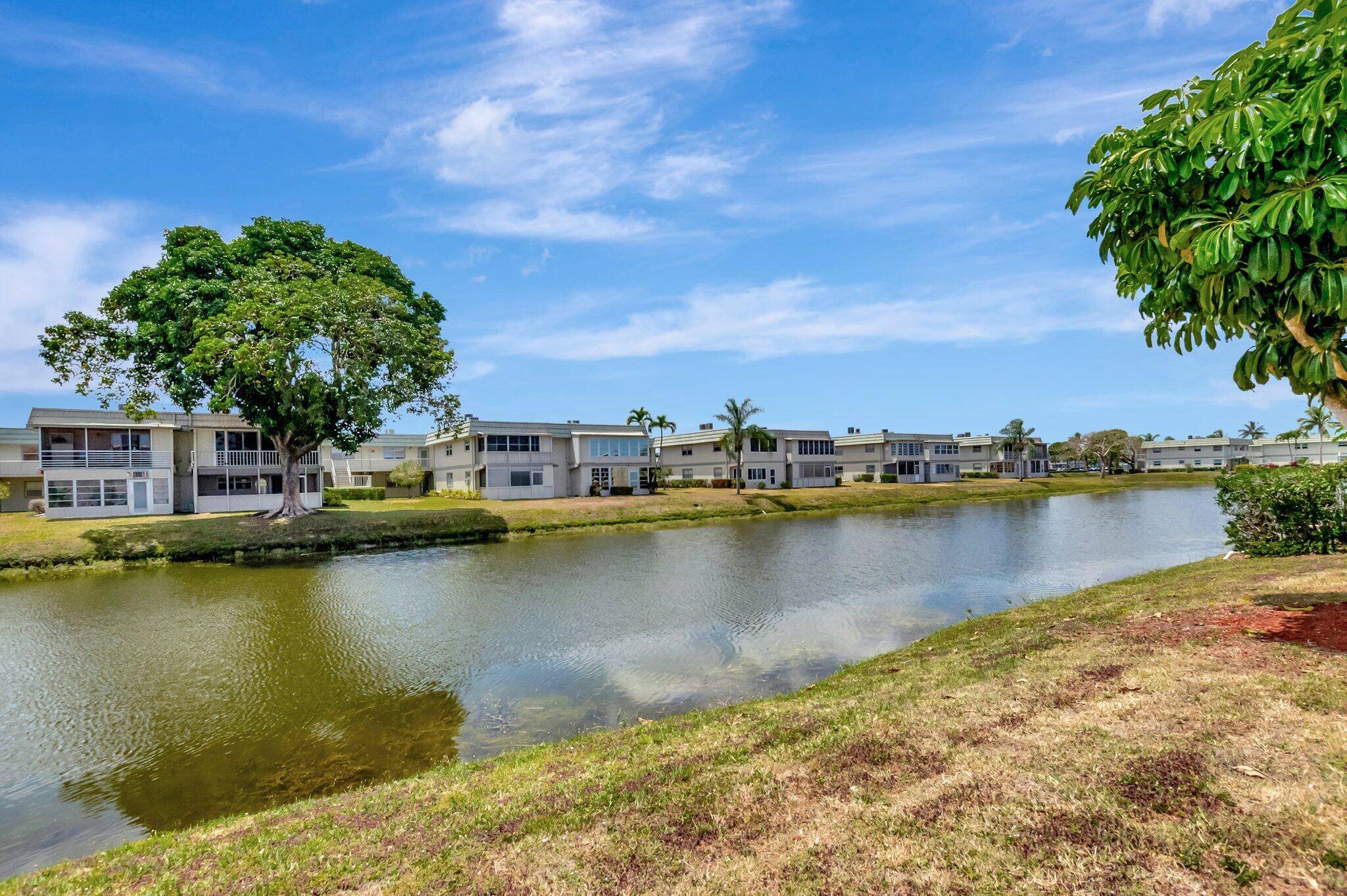WOW ! Very private, upgraded, rarely offered most desirable bldg, CBS 1st floor, 2 2 backs to lake, park in front of unit.