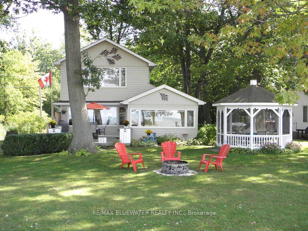 Unobstructed Lake view 3 season cottage on Lake Huron located with Lake directly on other side of road.