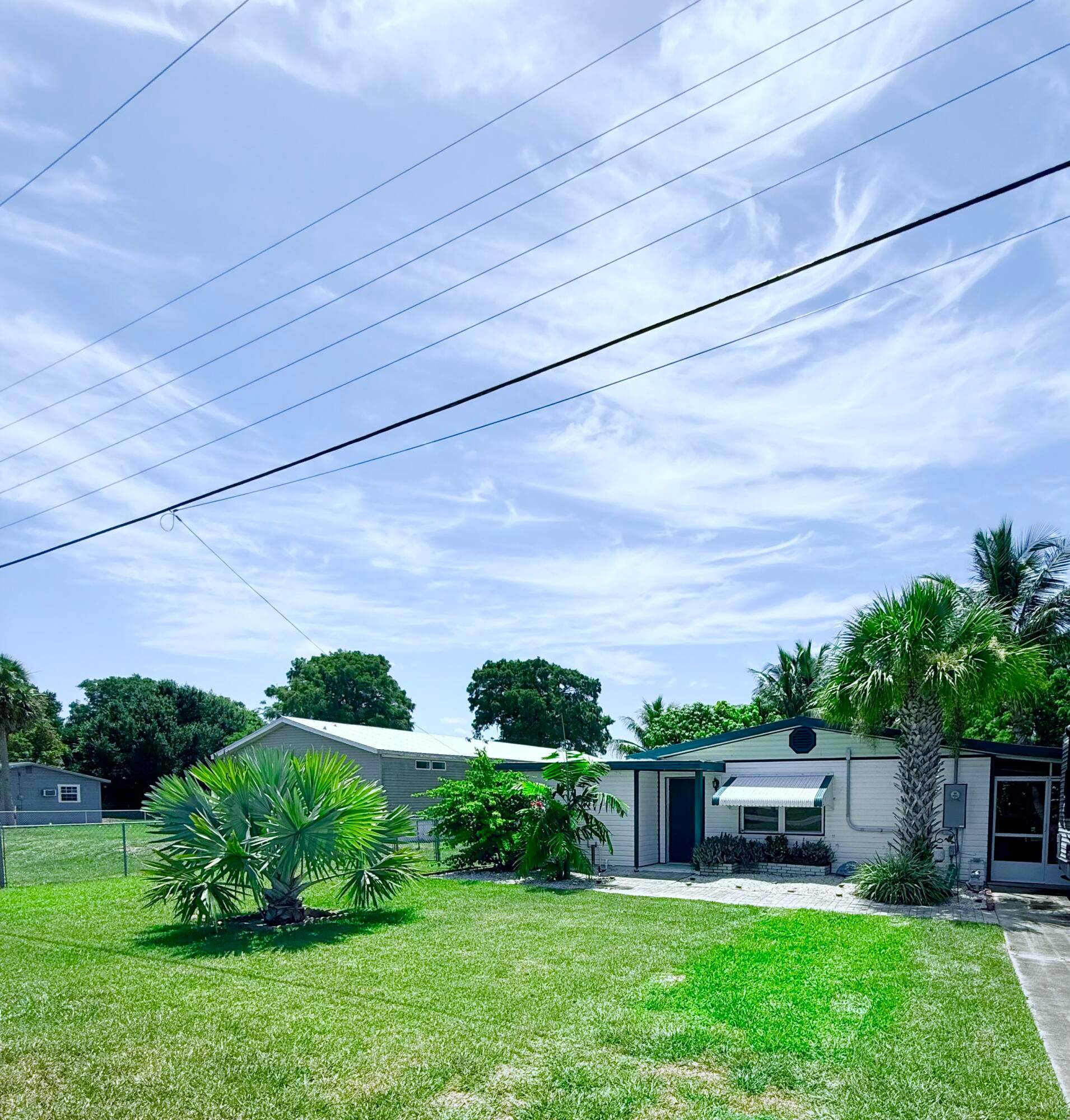 Enjoy the best of Florida living with this partially furnished charming 2 bedroom, 1 bath home featuring direct Okeechobee Lake access with your own private boat slip and dock perfect ...