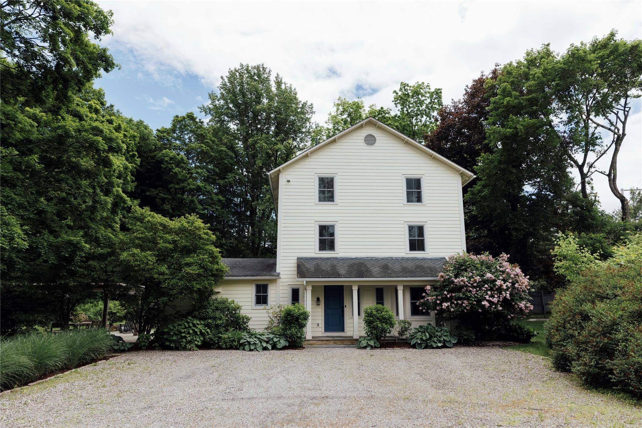 This c. 1880 three story farmhouse seamlessly blends historic charm with modern luxury, meticulously cared for and thoughtfully curated to offer both timeless elegance and contemporary comfort.