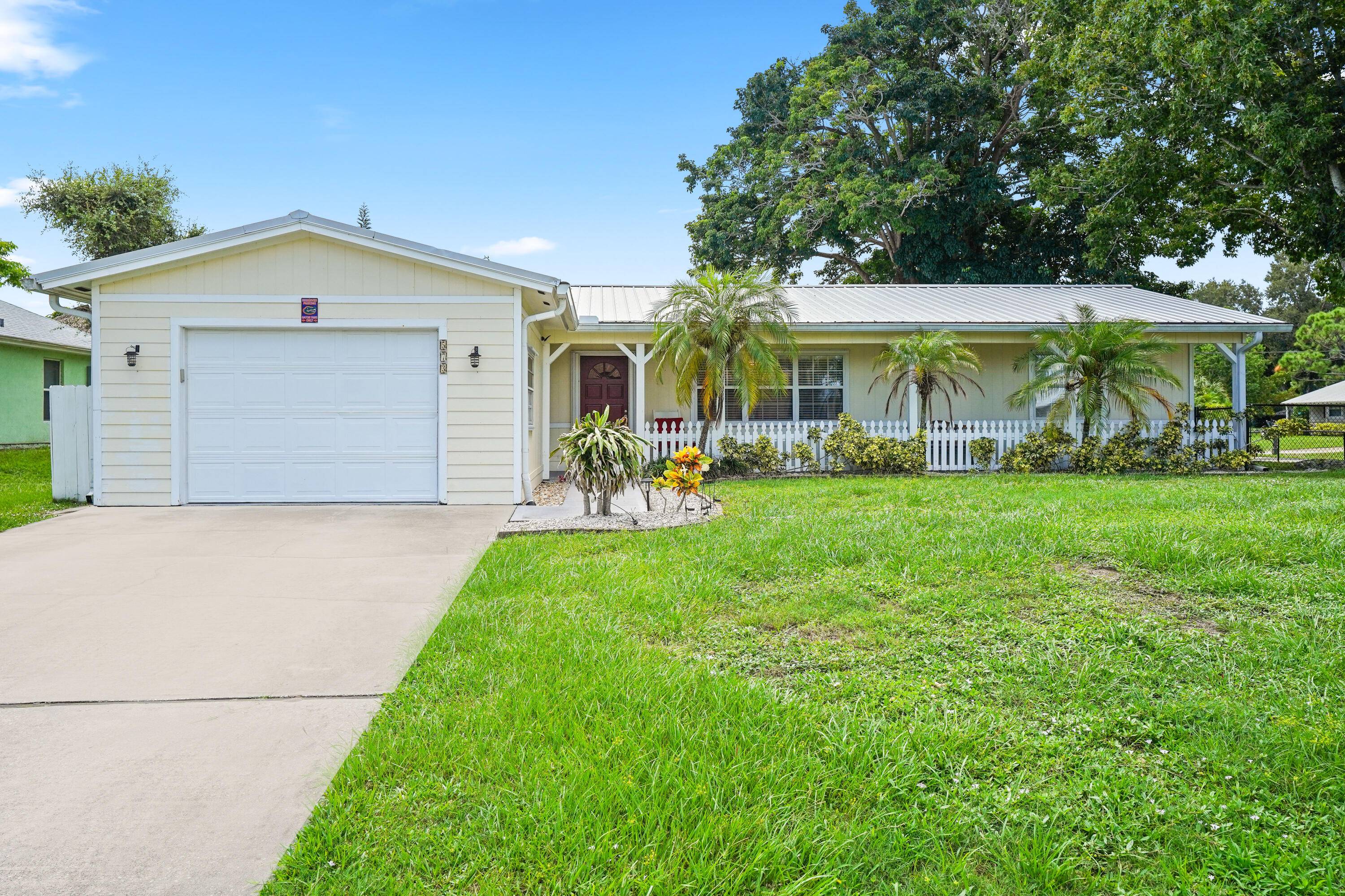 Charming Key West style 3 bedroom, 2 bath, 1 car garage home on an oversized fenced corner lot.