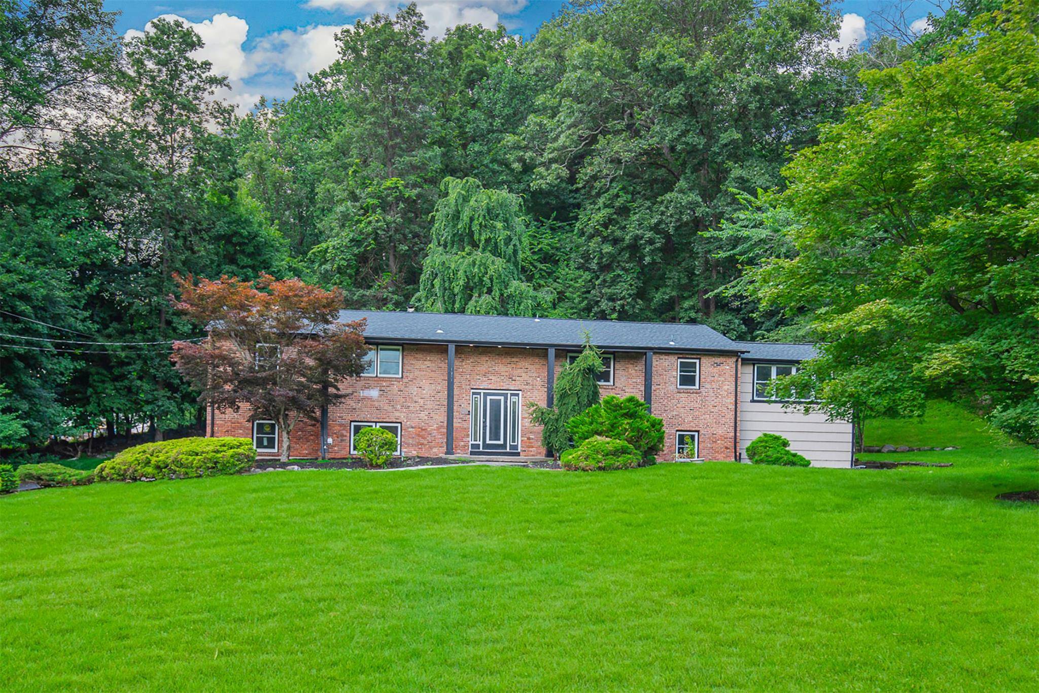 Renovated Raised Ranch located on a quiet cul de sac in desirable Wesley Hills.