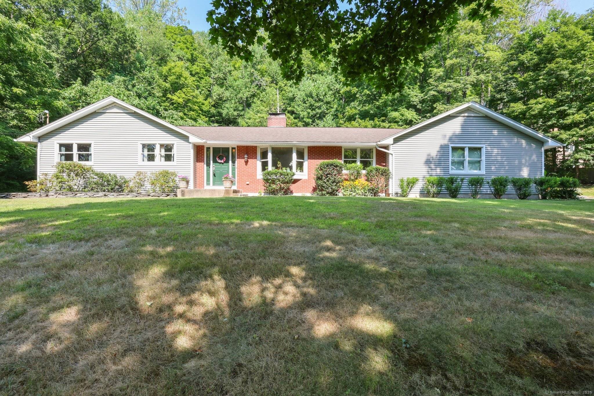 Beautifully Updated 3 Bedroom Home on a Private Lot with Dual Garages attached 2 car and a detached 2 car !