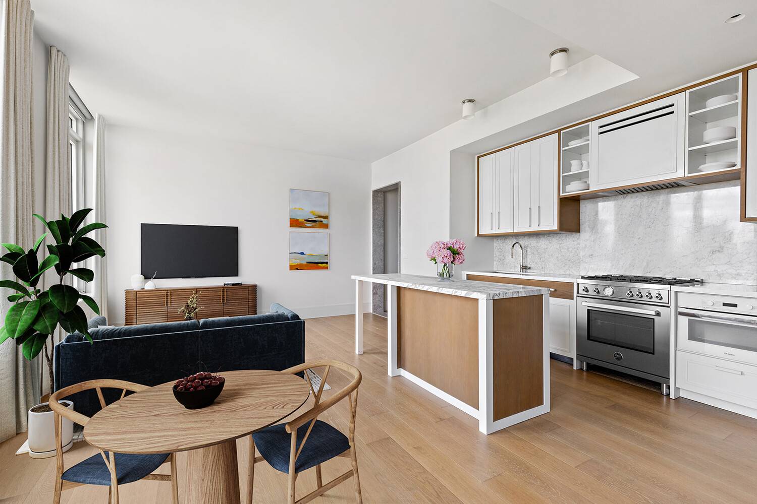 This oversized one bedroom with powder features large windows, wide plank white oak flooring, and custom finishes throughout.