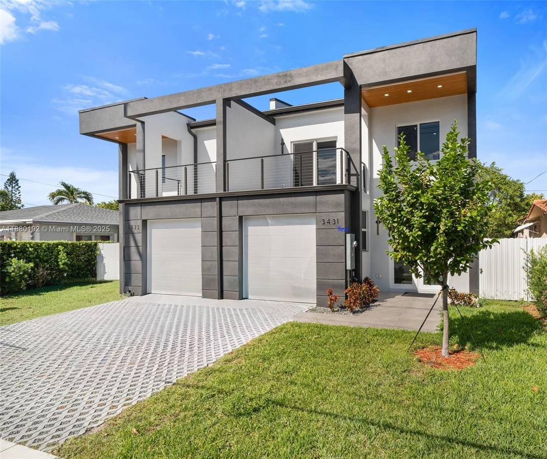 This newly built townhome, moments from Coral Gables, blends sleek architecture with timeless sophistication.