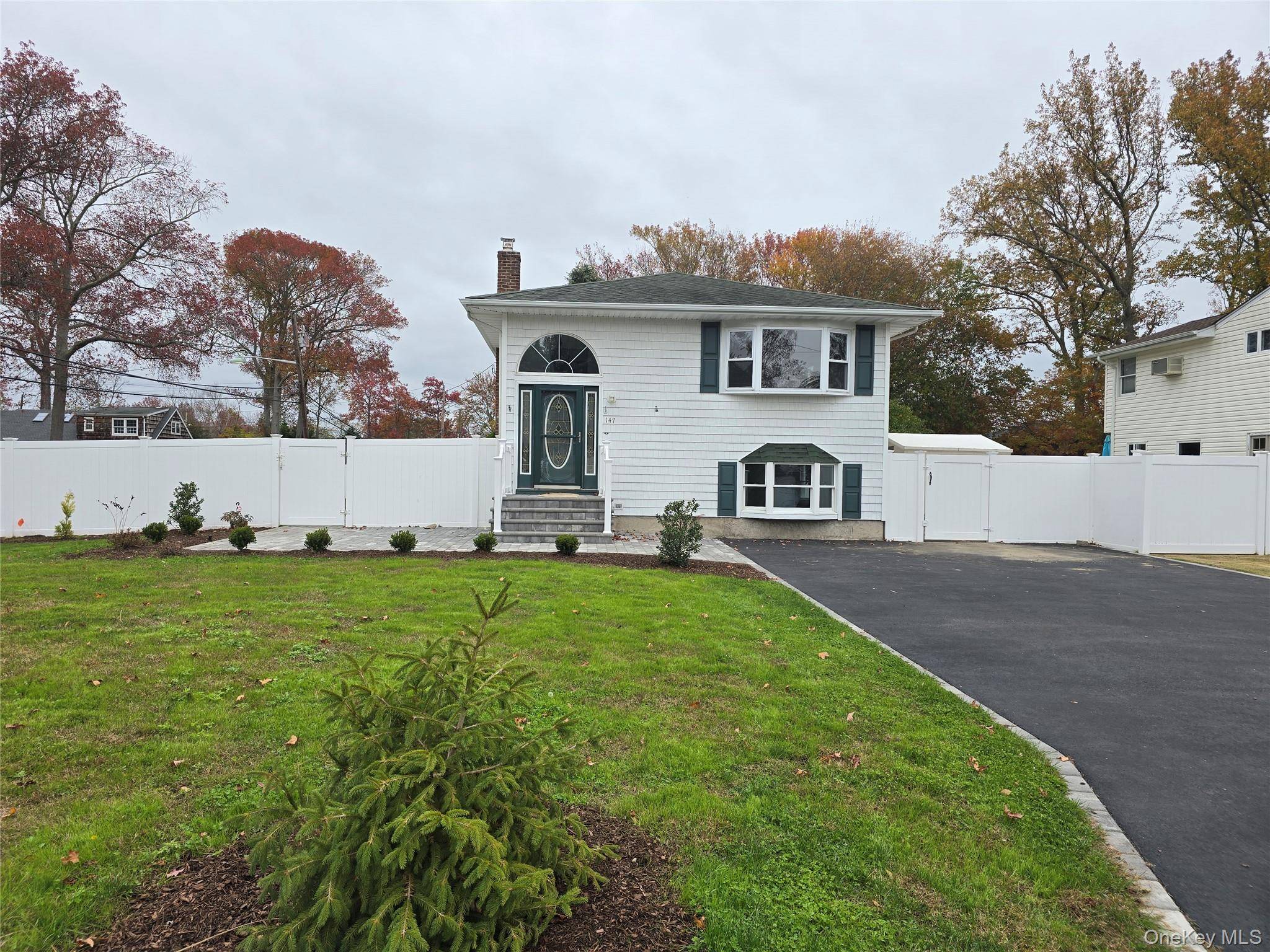 Move in ready and beautifully renovated 4 Bedroom, 2 Bath Hi Ranch located South of Montauk in Oakdale.