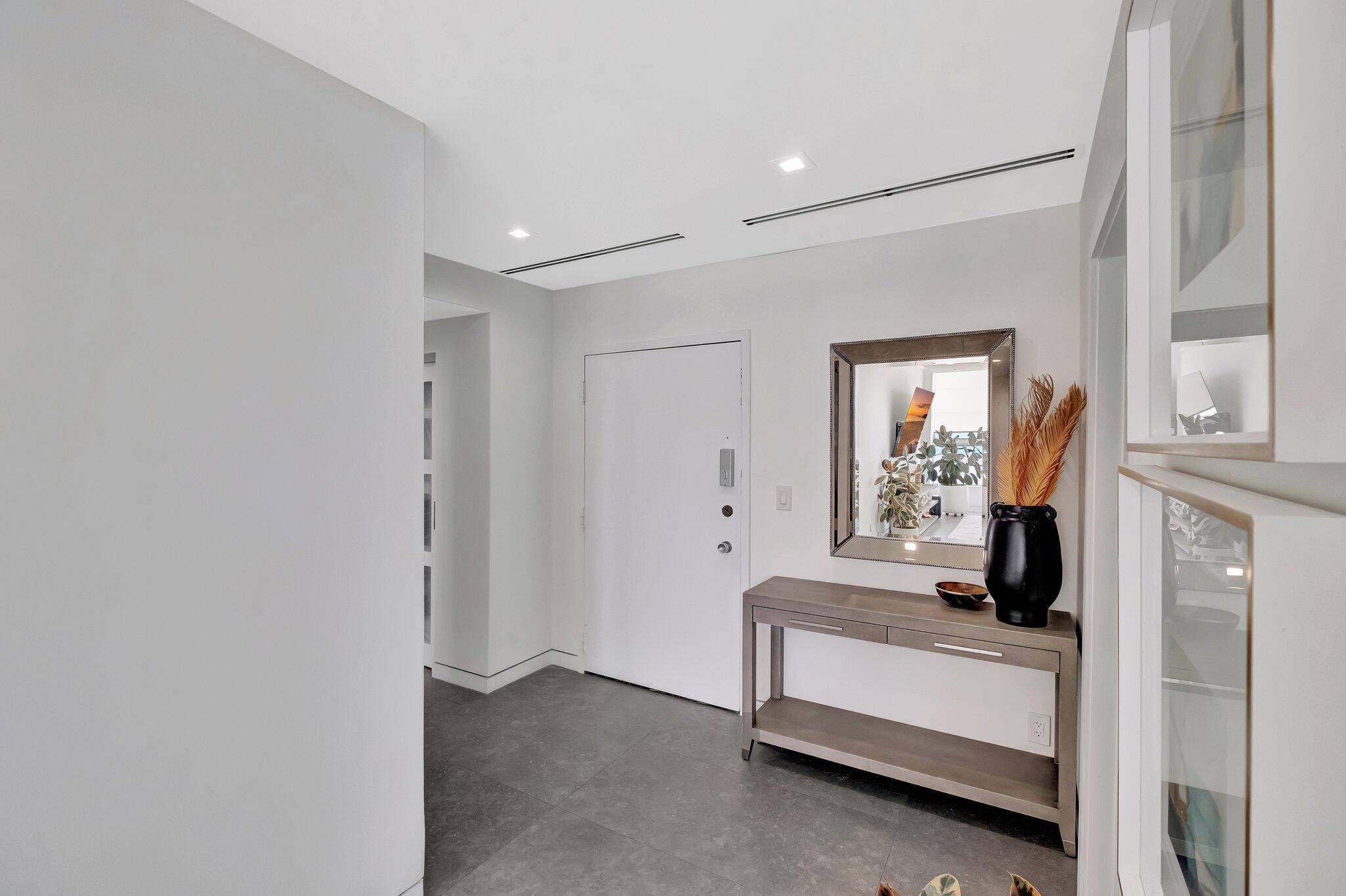 Welcome to your dream oceanfront lower penthouse condo, where modern luxury meets coastal living.