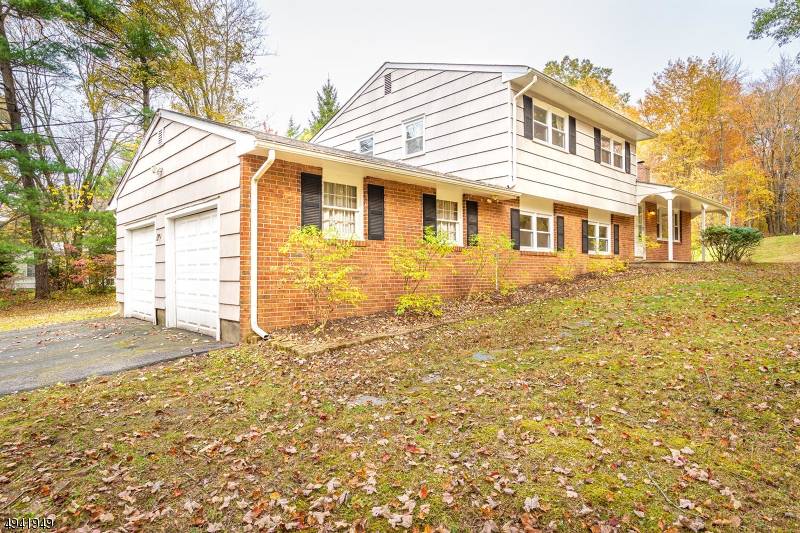 Nestled in over 1 acre lot, Brick front split level house in Montgomery township.