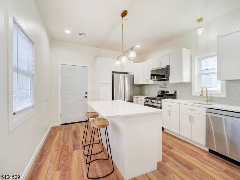 Tired of the snow ? This commuter friendly gem has no driveway to shovel and offers train stop around the corner.