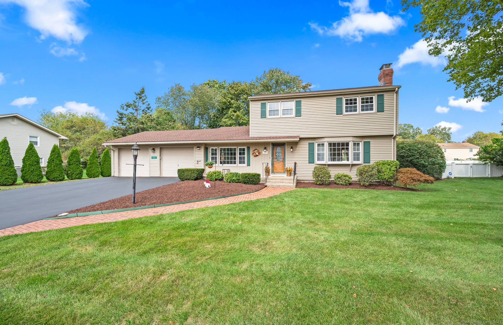 Beautiful curb appeal and a sidewalk lined neighborhood nestled in Glastonbury greets every greets every guest.