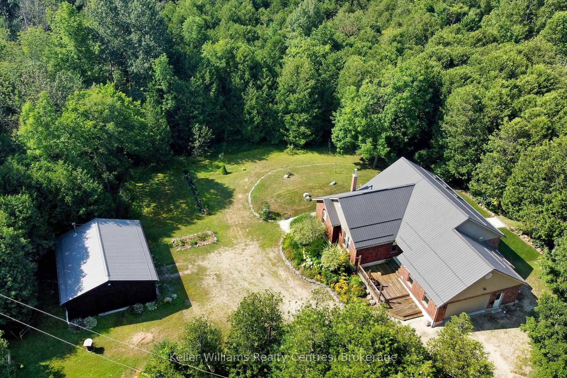 This 2006 brick bungalow sits on over 20 acres and comes complete with a 28' x 32' workshop, charming cottage, private pond, walking or ATV trails, and the beautiful Deer ...